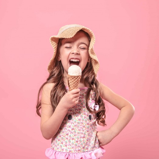 portrait-little-cheerful-girl-summer-hat-with-ice-cream-her-hands-colored-pink-background-summer-concept-scaled.jpg